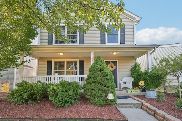 view of property with covered porch