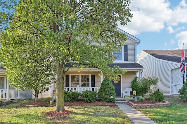 view of front facade with a porch and a front yard