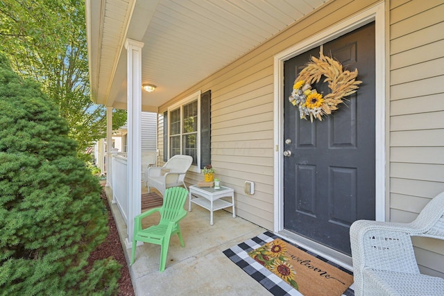 entrance to property featuring a porch