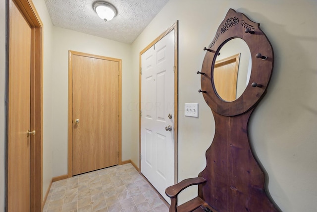 interior space with a textured ceiling