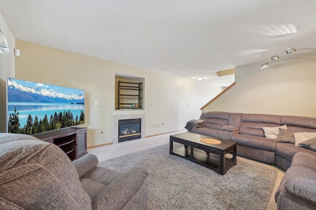 carpeted living room with a textured ceiling