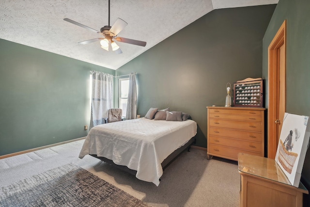 carpeted bedroom with a textured ceiling, ceiling fan, and lofted ceiling