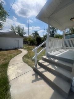 view of yard with covered porch