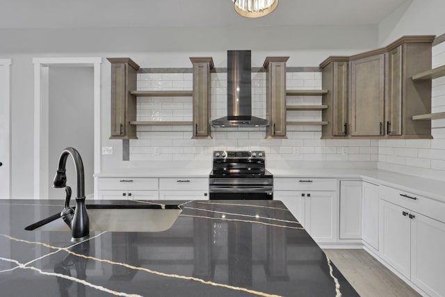 13917 Fantasy Way, Pickerington, OH 43147 - kitchen with electric range, wall chimney exhaust hood, tasteful backsplash, light hardwood / wood-style floors, and white cabinets