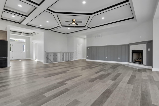 13917 Fantasy Way, Pickerington, OH 43147 - unfurnished living room featuring ceiling fan, light hardwood / wood-style flooring, and coffered ceiling