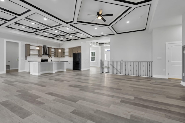 13917 Fantasy Way, Pickerington, OH 43147 - unfurnished living room with ceiling fan, sink, light hardwood / wood-style floors, and coffered ceiling