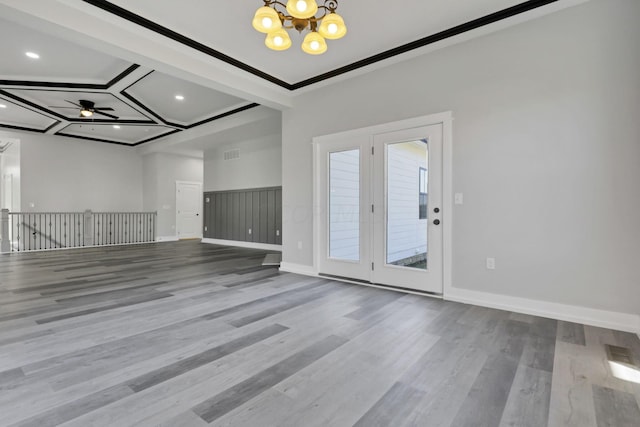 13917 Fantasy Way, Pickerington, OH 43147 - spare room featuring ceiling fan with notable chandelier, wood-type flooring, and crown molding