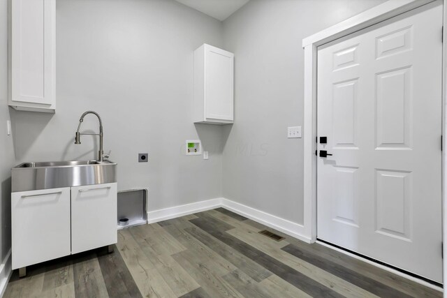 13917 Fantasy Way, Pickerington, OH 43147 - clothes washing area featuring electric dryer hookup, cabinets, dark wood-type flooring, sink, and hookup for a washing machine