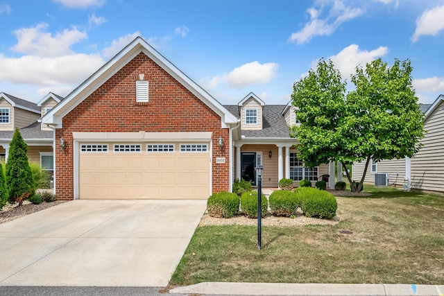 view of front of house featuring a front yard and a garage