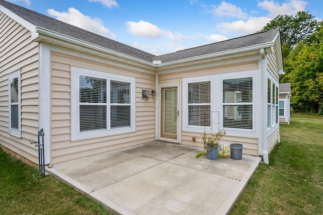 exterior space featuring a lawn and a patio