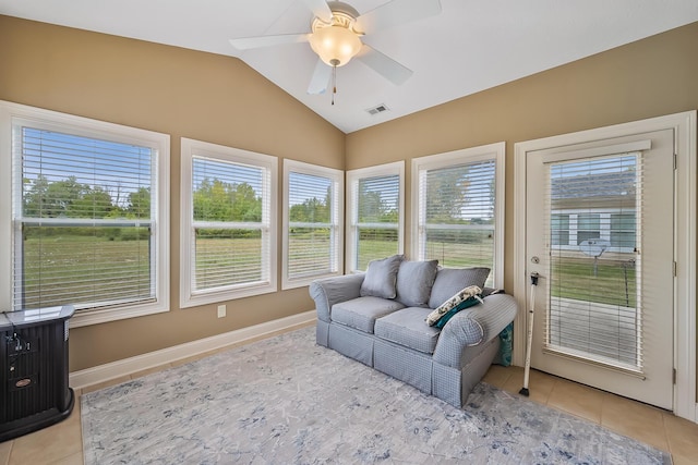 sunroom / solarium featuring ceiling fan, a healthy amount of sunlight, and vaulted ceiling