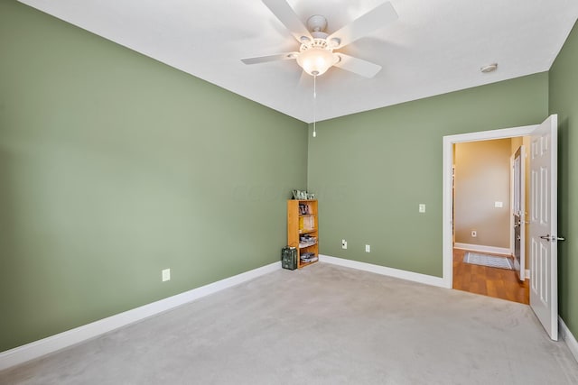 unfurnished bedroom with light colored carpet and ceiling fan