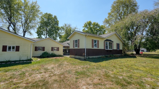 view of property exterior with a lawn