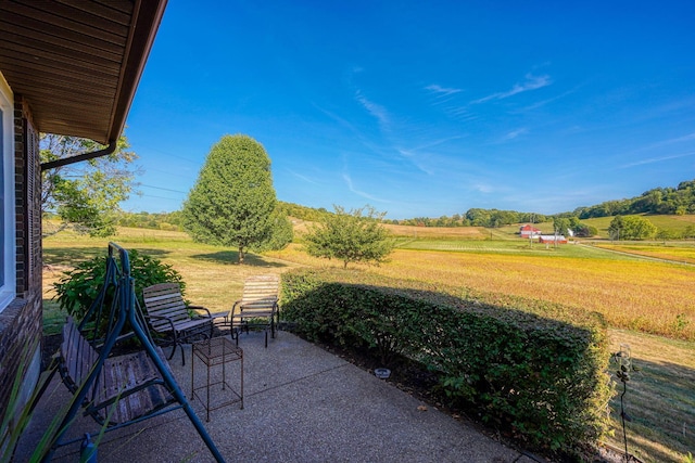 view of patio / terrace with a rural view