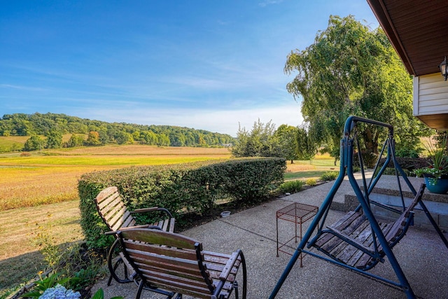 view of patio with a rural view