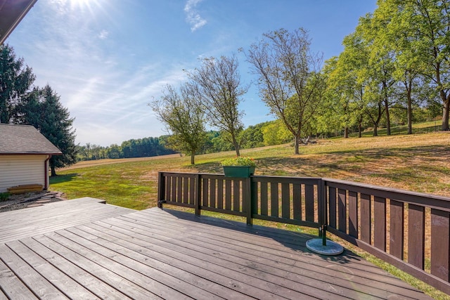 wooden deck with a lawn