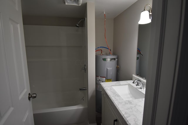 bathroom featuring vanity, electric water heater, and washtub / shower combination