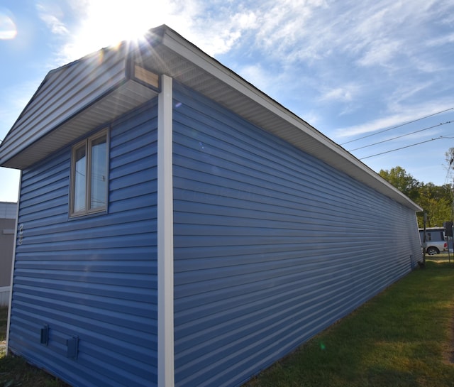 view of home's exterior featuring a lawn