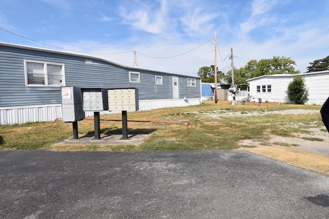 view of property exterior featuring a mail area