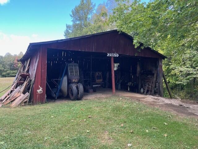 view of outbuilding with a lawn