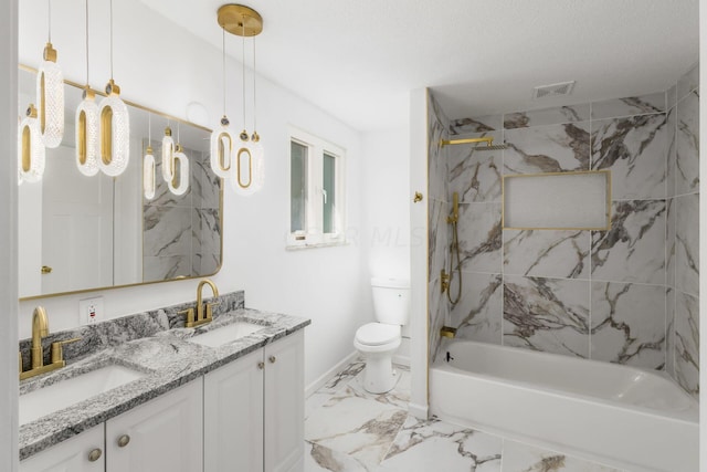 full bathroom featuring a textured ceiling, vanity, toilet, and tiled shower / bath