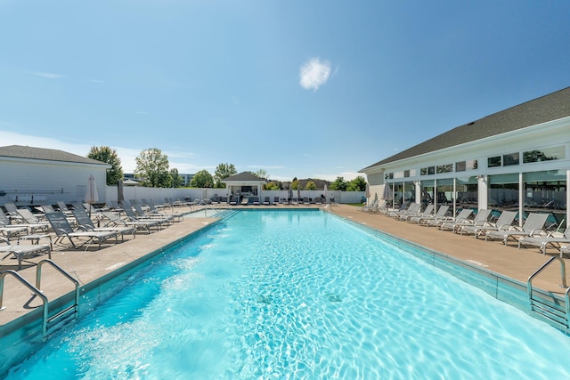 view of swimming pool with a patio area