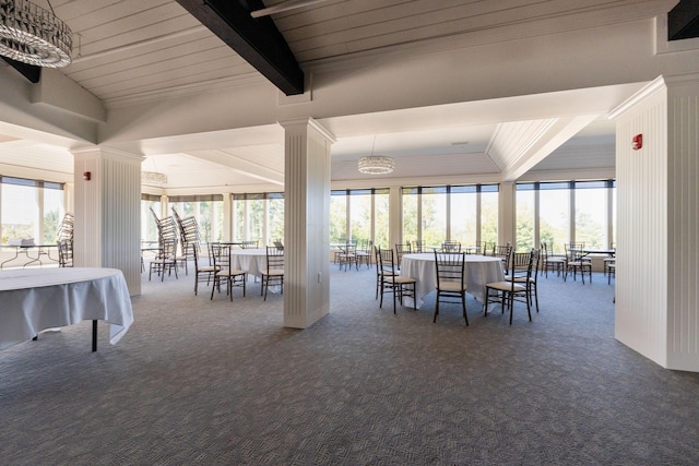 dining area featuring wood ceiling, lofted ceiling with beams, a chandelier, and dark carpet