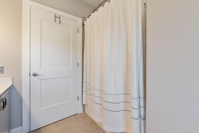 bathroom with tile patterned floors and vanity