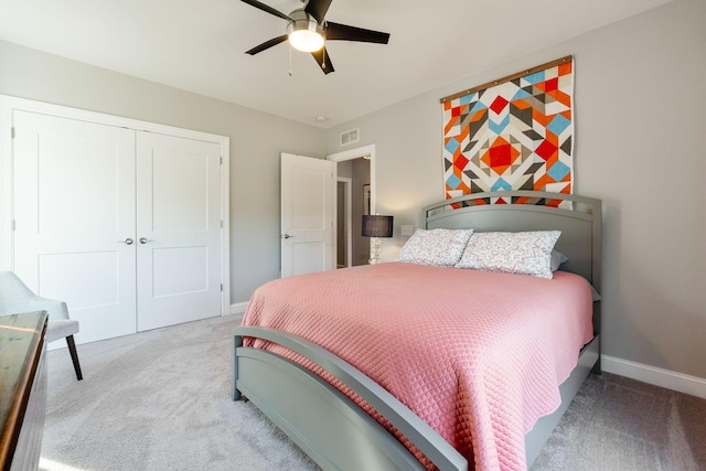 bedroom with ceiling fan, a closet, and carpet floors