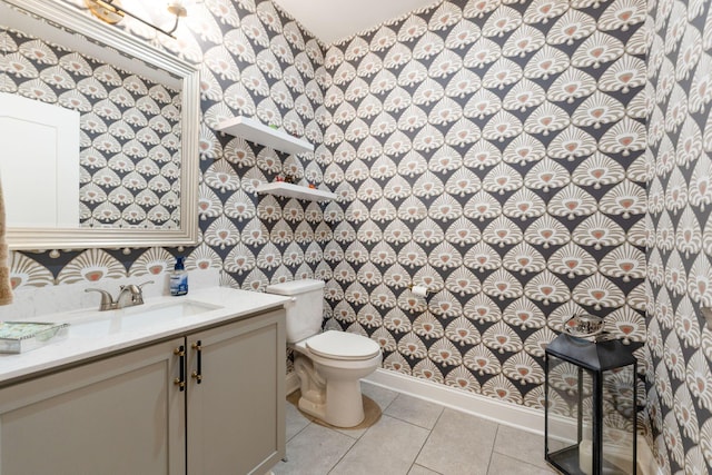 bathroom with tile patterned floors, vanity, and toilet