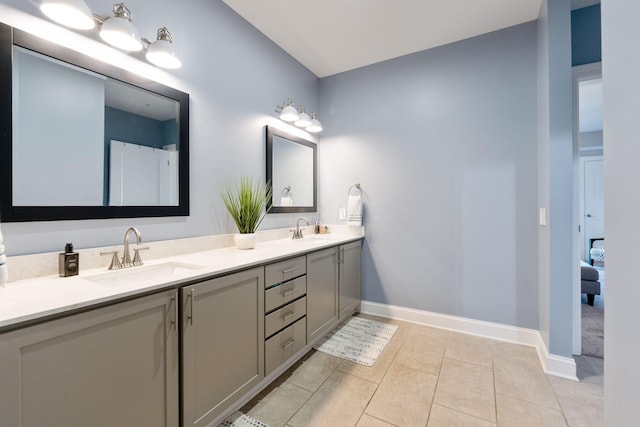 bathroom featuring tile patterned flooring and vanity