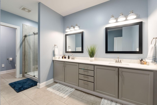 bathroom with vanity, tile patterned floors, and walk in shower