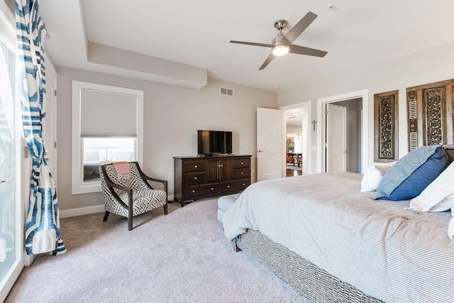 bedroom with light carpet and ceiling fan