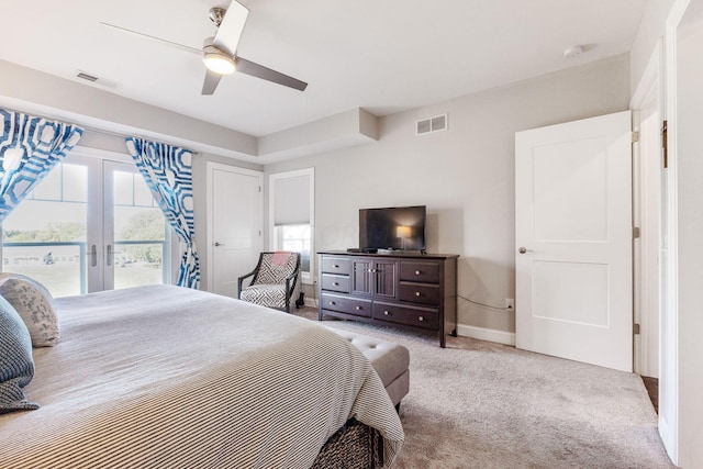 bedroom featuring light carpet, french doors, access to outside, and ceiling fan