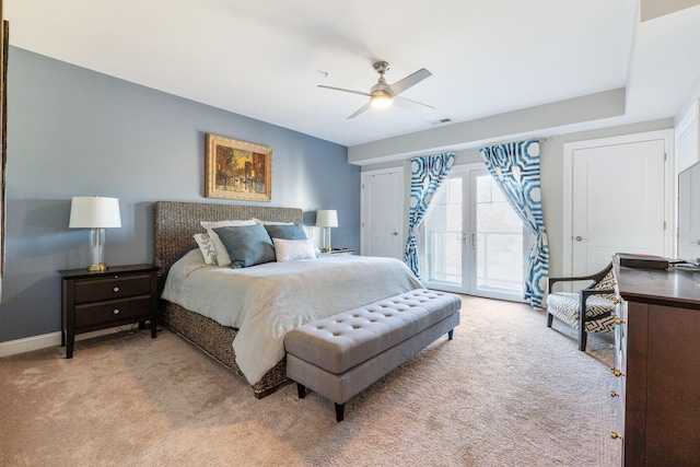 carpeted bedroom featuring ceiling fan, access to exterior, and french doors