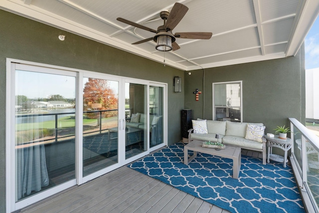 sunroom featuring ceiling fan