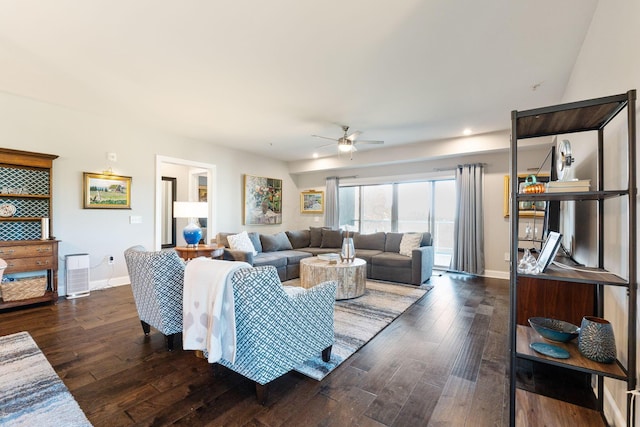 living room featuring dark hardwood / wood-style floors and ceiling fan