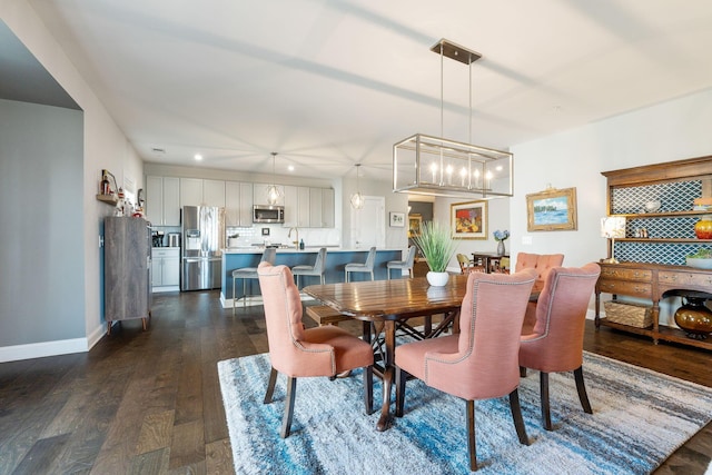 dining space featuring dark hardwood / wood-style flooring