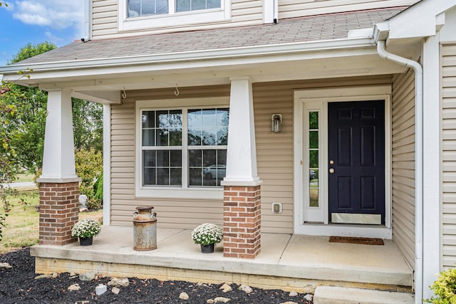 doorway to property featuring covered porch