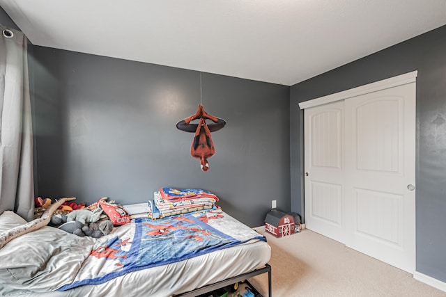 bedroom with carpet floors and a closet