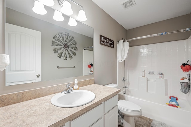 full bathroom with shower / tub combo, vanity, toilet, and tile patterned floors