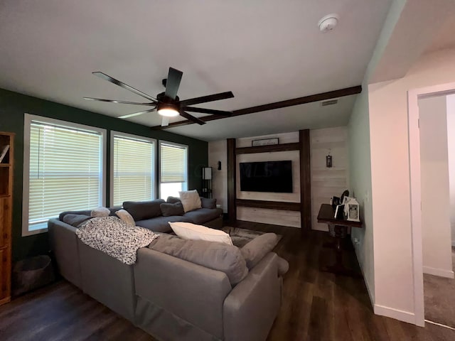 living room with dark hardwood / wood-style flooring and ceiling fan