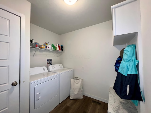 washroom featuring washer and clothes dryer and dark hardwood / wood-style floors