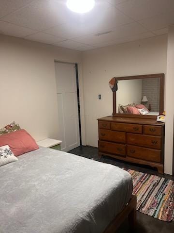 bedroom featuring a drop ceiling