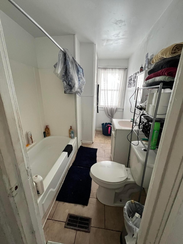 full bathroom featuring tile patterned flooring, vanity, tub / shower combination, and toilet