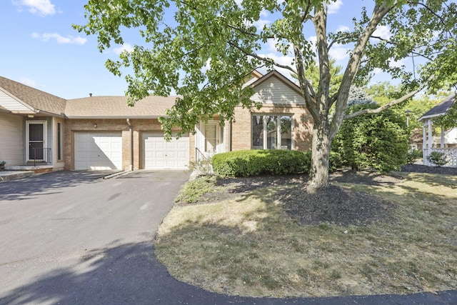 single story home with a garage