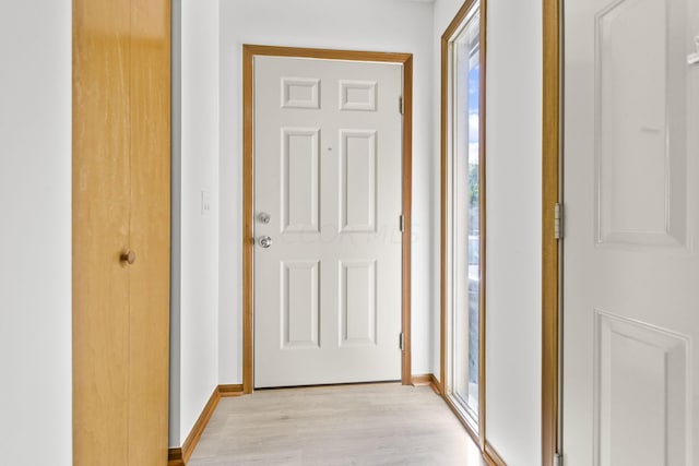 corridor featuring light hardwood / wood-style flooring