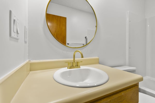 bathroom featuring vanity and toilet