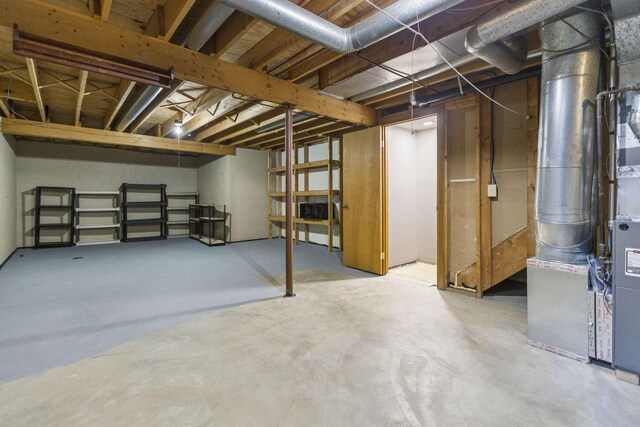 basement featuring heating unit