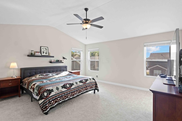 carpeted bedroom with ceiling fan and lofted ceiling